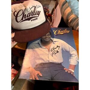 Program & vintage trucker hat Charley Pride. Both autographed by Charley Pride